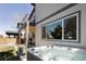 Relaxing backyard hot tub with a covered patio and string lights, great for entertaining and unwinding at 3427 S Cherry St, Denver, CO 80222