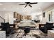 A wide angle shot of the open concept living room, with views of the kitchen and dining area at 3427 S Cherry St, Denver, CO 80222