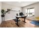 Bright office space with hardwood floors, a modern desk, and large window providing ample natural light at 3427 S Cherry St, Denver, CO 80222