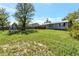 Expansive backyard with a grassy lawn, deck and a swing set, perfect for outdoor enjoyment at 1204 S Salida Way, Aurora, CO 80017
