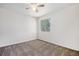 Bedroom featuring neutral walls, carpet flooring, a ceiling fan and a window providing natural light at 4697 Waldenwood Dr, Highlands Ranch, CO 80130