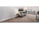 Finished basement offers a comfortable seating area, decor, and a bar top table at 1865 S Logan St, Denver, CO 80210