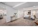 Open bedroom featuring neutral walls, carpet flooring, and minimal but tasteful decor at 1865 S Logan St, Denver, CO 80210