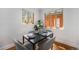 Bright dining area with hardwood floors, neutral walls and modern decor at 1865 S Logan St, Denver, CO 80210