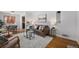Inviting living room featuring a stylish gray rug, comfortable seating, and hardwood floors at 1865 S Logan St, Denver, CO 80210