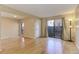 Bright living room featuring hardwood floors, and a sliding glass door to the outside patio at 9356 W Utah Pl, Lakewood, CO 80232