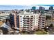 High-angle view of a multi-story condo building with balconies and well-manicured landscaping at 4875 S Monaco St # 103, Denver, CO 80237