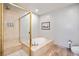 Luxurious bathroom featuring a soaking tub and a glass enclosed shower at 4875 S Monaco St # 103, Denver, CO 80237