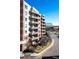 Brick building with multiple balconies and street views at 4875 S Monaco St # 103, Denver, CO 80237