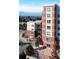 Modern brick building with large windows and mountain views in the background at 4875 S Monaco St # 103, Denver, CO 80237