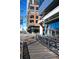 Commercial space with storefronts including Tap & Burger, One7, Crisp & Green, and outdoor seating along a city street at 4875 S Monaco St # 103, Denver, CO 80237