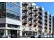 Street view of commercial building with Tap & Burger, custom restaurant storefronts and outdoor seating at 4875 S Monaco St # 103, Denver, CO 80237