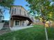 Inviting backyard deck with railings, stairs down to the yard, and a convenient sliding door at 23760 Broadmoor Dr, Parker, CO 80138