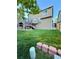 View of the spacious backyard showcasing the home's two-tiered deck and well-maintained lawn at 23760 Broadmoor Dr, Parker, CO 80138