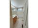 A well-lit bathroom featuring a single vanity, bathtub, and neutral tile flooring at 23760 Broadmoor Dr, Parker, CO 80138