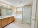 Bathroom with double sink vanity, soaking tub and glass shower at 23760 Broadmoor Dr, Parker, CO 80138
