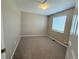 Bedroom with neutral walls, carpet and a window to let in natural light at 23760 Broadmoor Dr, Parker, CO 80138