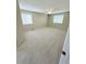 Spacious bedroom offers neutral walls and carpeting and window with covering to let in natural light at 23760 Broadmoor Dr, Parker, CO 80138