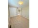 An empty bedroom with carpeted floors and a closet with white sliding doors at 23760 Broadmoor Dr, Parker, CO 80138
