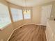 Cozy breakfast nook filled with natural light and wood-style floors at 23760 Broadmoor Dr, Parker, CO 80138