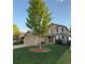 Charming two-story home with a well-maintained lawn and attached two-car garage at 23760 Broadmoor Dr, Parker, CO 80138