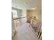 Hallway with carpet and railings that overlooks a spacious living area at 23760 Broadmoor Dr, Parker, CO 80138
