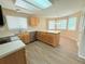 Kitchen with breakfast nook, light wood cabinetry, and stainless steel appliances at 23760 Broadmoor Dr, Parker, CO 80138