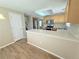 Bright open kitchen with counter seating, stainless steel appliances, and wood cabinets at 23760 Broadmoor Dr, Parker, CO 80138