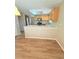 Open kitchen with bar, stainless steel appliances, and access to the breakfast nook at 23760 Broadmoor Dr, Parker, CO 80138