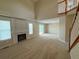 Expansive living room with a fireplace and sliding glass doors to the deck at 23760 Broadmoor Dr, Parker, CO 80138
