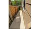 Narrow side yard with a concrete path and wood fence at 23760 Broadmoor Dr, Parker, CO 80138