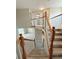 View of the carpeted staircase and railings leading to the upper level of the home at 23760 Broadmoor Dr, Parker, CO 80138