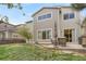 A backyard with a grass lawn and a patio at 1558 Wandering Way, Castle Rock, CO 80109