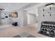 Spacious basement featuring a home gym and living area with a TV at 1558 Wandering Way, Castle Rock, CO 80109