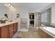 Bathroom showcasing a walk-in closet, walk-in shower, and a soaking tub at 1558 Wandering Way, Castle Rock, CO 80109