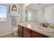 Bathroom with a sink, toilet, and a window at 1558 Wandering Way, Castle Rock, CO 80109