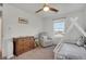 Cozy bedroom features a wooden dresser, comfortable seating, and a bed at 1558 Wandering Way, Castle Rock, CO 80109