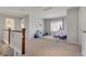 Bright bonus room with neutral walls and carpet flooring, perfect for a playroom or study area at 1558 Wandering Way, Castle Rock, CO 80109