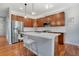 Modern kitchen with stainless steel appliances, a large island, and stylish pendant lighting at 1558 Wandering Way, Castle Rock, CO 80109