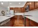 Modern kitchen featuring stainless steel appliances, quartz countertops, and ample cabinet space at 1558 Wandering Way, Castle Rock, CO 80109