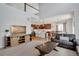 Open-concept living room, kitchen, and dining area with stainless steel appliances at 1558 Wandering Way, Castle Rock, CO 80109