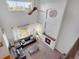 Bright living room with a fireplace, ceiling fan, and large windows providing lots of natural light at 1558 Wandering Way, Castle Rock, CO 80109