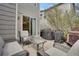 A patio with wicker furniture, a grill, and a glass table at 1558 Wandering Way, Castle Rock, CO 80109