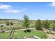 Landscaped backyard with patio, fenced yard, and beautiful views at 8661 S De Gaulle Ct, Aurora, CO 80016