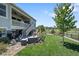 Backyard with a patio, grill and stairs to an upper deck at 8661 S De Gaulle Ct, Aurora, CO 80016