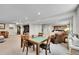 Open basement design with sitting area, desk area, dining table and chairs, with carpeted floors at 8661 S De Gaulle Ct, Aurora, CO 80016