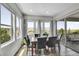 Dining room with natural light and hardwood flooring, offering tranquil views at 8661 S De Gaulle Ct, Aurora, CO 80016