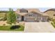Beautiful two story home featuring a three car garage and manicured front lawn at 8661 S De Gaulle Ct, Aurora, CO 80016