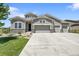 Charming home featuring stone accents and a well-manicured lawn at 8661 S De Gaulle Ct, Aurora, CO 80016