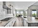 Bright kitchen featuring stainless appliances, gas range, and scenic dining area at 8661 S De Gaulle Ct, Aurora, CO 80016